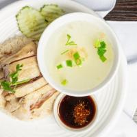 Hainan Chicken Over Rice · Steamed chicken served over ginger rice with our sweet and spicy ginger garlic sauce. Come w...