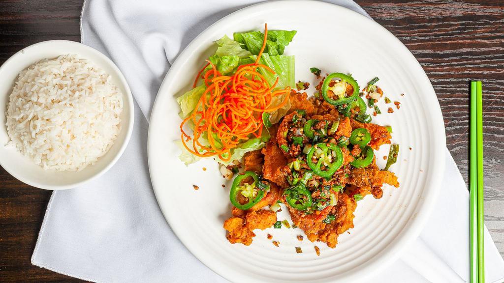 Pork Chop - Salt & Pepper · Popular choice. Lightly battered deep-fried pork chop, then stir-fried with garlic, green onion, and jalapeño tossed with salt and pepper, served with jasmine rice.