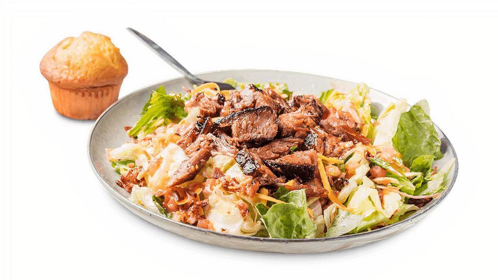 Dave'S Sassy Bbq Salad · Crisp greens, bacon, Cheddar cheese, tomatoes, shoestring potatoes with honey BBQ dressing.