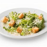 Caesar Side Salad · Crisp romaine lettuce topped with parmesan cheese and croutons, with Caesar dressing on the ...
