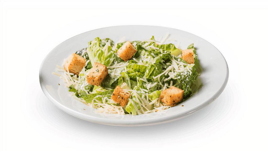 Caesar Side Salad · Crisp romaine lettuce topped with parmesan cheese and croutons, with Caesar dressing on the side.