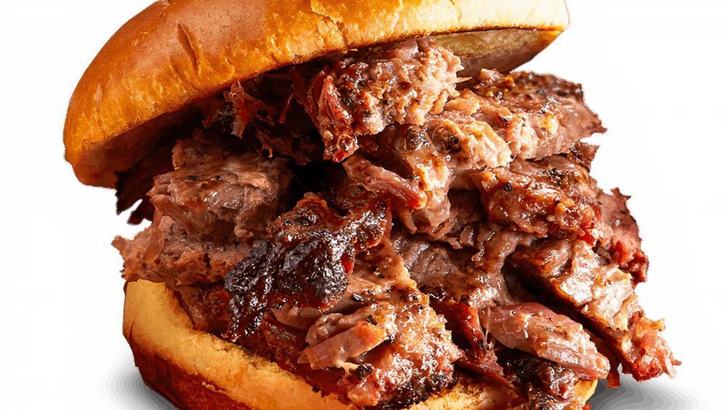 Texas Beef Brisket Sandwich · Piled high with hand-seasoned, hickory-smoked Texas Beef Brisket. . Served with choice of 1 side and spicy Hell-Fire Pickles.