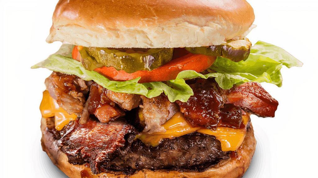 Ultimate Burger* · Piled high with Georgia Chopped Pork and two strips of bacon, melted sharp American cheese, lettuce, tomato and our signature Sweet & Zesty BBQ sauce. Served with choice of one side and spicy Hell-Fire Pickles.