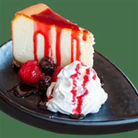 Strawberry Cheesecake · Creamy, smooth vanilla New York cheesecake served with strawberry sauce and topped with whip...