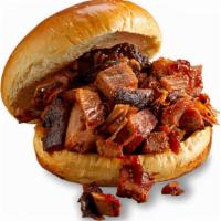Georgia Chopped Pork Sandwich · Slow-smoked chopped pork topped with Rich & Sassy®. . Served with choice of 1 side and spicy...
