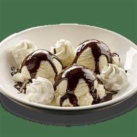 Kids' Ice Cream Sundae · Vanilla ice cream with a choice of hot fudge or pecan praline and whipped cream on the side.