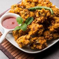 Vegetable Pakora · Fresh vegetables dipped in a special batter and fried to golden perfection