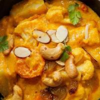 Navratan Korma · Nine fresh garden vegetables marinated in a yogurt and cooked in cream and specially blended...