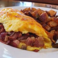 Hungry Hank · Four eggs, bacon, sausage, ham, andouille sausage, and cheese (a major meat-fest for your br...