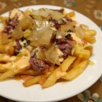 Pastrami Fries · Lots of pastrami, melted cheese, chopped tomato, grilled onion, pickles, and our house-made ...