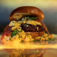 Dirty Deeds · 6oz signature burger patty, cheddar mac n cheese, jalapeno, bacon, brioche bun. Served medium.