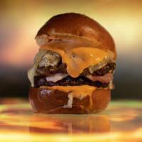 The Number Of The Black · 6oz signature burger patty, corned beef, smoked swiss, caramelized onions, sauerkraut, thous...