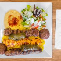 The Works · Beef kabob, kofta kabob, chicken kabob, two falafel patties and two hand rolled grape leaves.