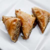 Baklava · Sweet pastry made of phyllo dough filled with chopped walnuts and topped off with pistachios.