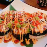 Volcano Roll · In: imitation crab, mix sashimi and avocado.
Top: masago, green onion, sauces and wrapped wi...