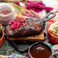Grilled Cedar Plank Brisket · bbq roasted on cedar wood dressed with lime + pickled red onion and served with mashed potat...