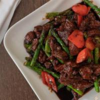 Filet Mignon French Style · Spicy. Sliced filet mignon stir-fried with asparagus, red bell peppers and white onions in o...