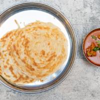 Parotta W/ Chicken Curry · Two pcs of parotta served with chicken curry.