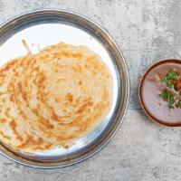 Parotta W/ Mutton Curry · Two pcs of parotta served with mutton curry.