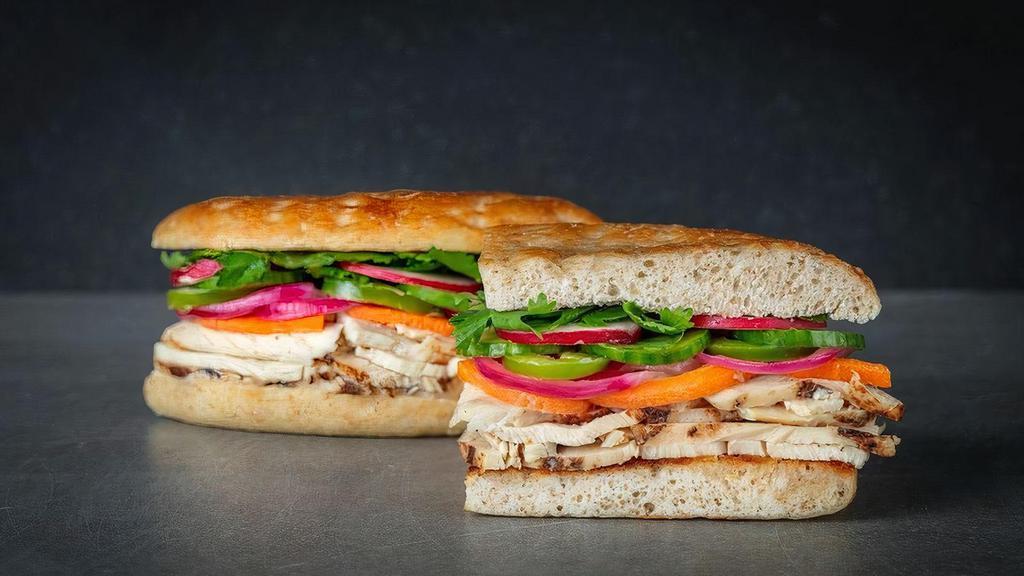 Uc Banh Mi · italian chicken, cilantro, cucumber, jalapenos, pickled carrots, pickled onion, red radish, sweet chili aioli. Served with Urbane Side Salad