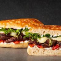 Bella Portobello · marinated portobello mushroom, mozzarella cheese, sundried tomatoes, basil pesto, vegenaise,...