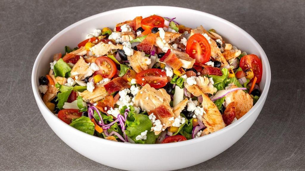 Santa Maria Bbq Chicken · roasted BBQ chicken, chop salad slaw mix, Applewood-smoked bacon, crumbled goat cheese, corn & black bean salsa, grape tomatoes, blackberry BBQ sauce drizzle, with chipotle ranch dressing. Served with Fresh Baked Focaccia Bread