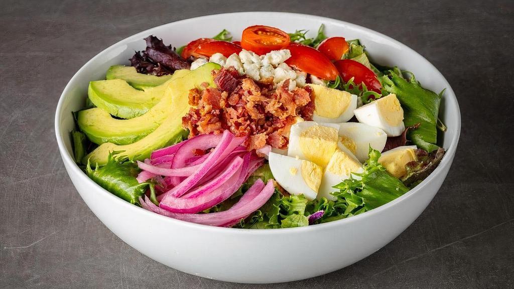 Keto Cobb Salad · mixed greens, chopped greens, hard boiled egg, avocado, tomatoes, pickled onions, gorgonzola, bacon, with Blue Cheese Dressing. Served with Fresh Baked Focaccia Bread