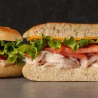 Turkey Sandwich · roasted turkey, cheddar cheese, sliced tomato, green leaf lettuce, mayo on fresh baked focac...