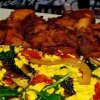 Vegan Scrambled · Organic tofu scrambled with roasted peppers, sun dried tomatoes, portobello mushrooms, red o...
