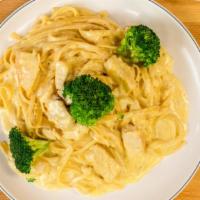 Fettuccine Alfredo With Chicken · Served with garlic bread and salad.