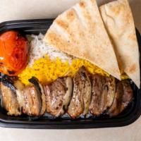 Lamb Shish Kabob · Tender, grilled pieces of lamb, marinated in our signature saffron seasoning, served with ri...