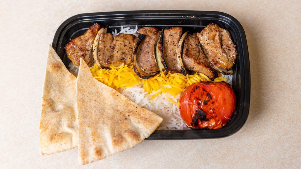 Beef Shish Kabob · Juicy chunks of char broil top sirloin. Marinated in our signature saffron seasoning, served with rice,  and hummus.