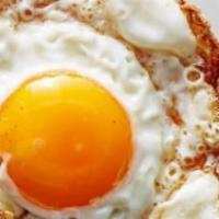 Side Sunny Side Fried Egg · Perfect complement to any dish, a sunny side fried egg