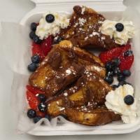 Nutella French Toast Premium · French Toast with Nutella, strawberry, blueberry, syrup, powdered sugar on top and whipped c...