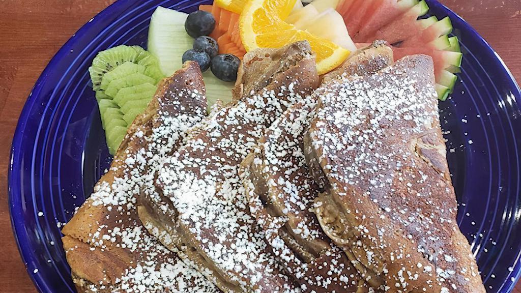 French Toast Breakfast · Whole wheat bread soaked in vanilla soy milk served with seasonal fruits.