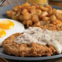Chicken-Fried Steak & Eggs · Two farm-fresh eggs with steak lightly seasoned and fried to a golden brown, then topped wit...