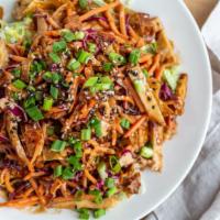 Asian Chicken Salad · Sliced chicken breast, crispy fried wonton strips, red  and green cabbage, carrots and crisp...