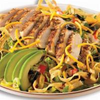 Southwest Chicken Salad · Chicken seasoned with zesty chili spice and served over crisp romaine lettuce with cheddar c...
