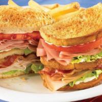 Club House Classic · Roasted turkey breast, ham and applewood-smoked bacon  piled high on toasted sourdough with ...