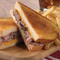 Grilled Four-Cheese Prime Rib Melt · Grilled sourdough filled with cheddar cheese, Swiss cheese, Jack cheese, Parmesan cheese and...