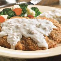 Chicken-Fried Steak · Lightly seasoned and fried golden brown. Topped  with Carrows’ country sausage gravy and ser...