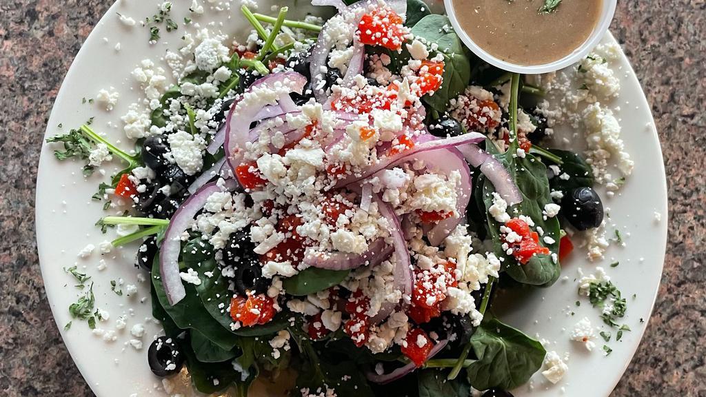 Spinach Salad · Baby spinach greens, roasted peppers, feta, olives, red onion.