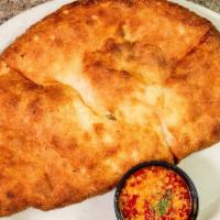 Cheese Calzone · Dough pocket stuffed with ricotta and mozzarella cheese.