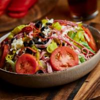 Antipasto Salad · Fresh romaine lettuce, pepperoni, salami, ham, olives, tomato's, and thinly sliced onions & ...