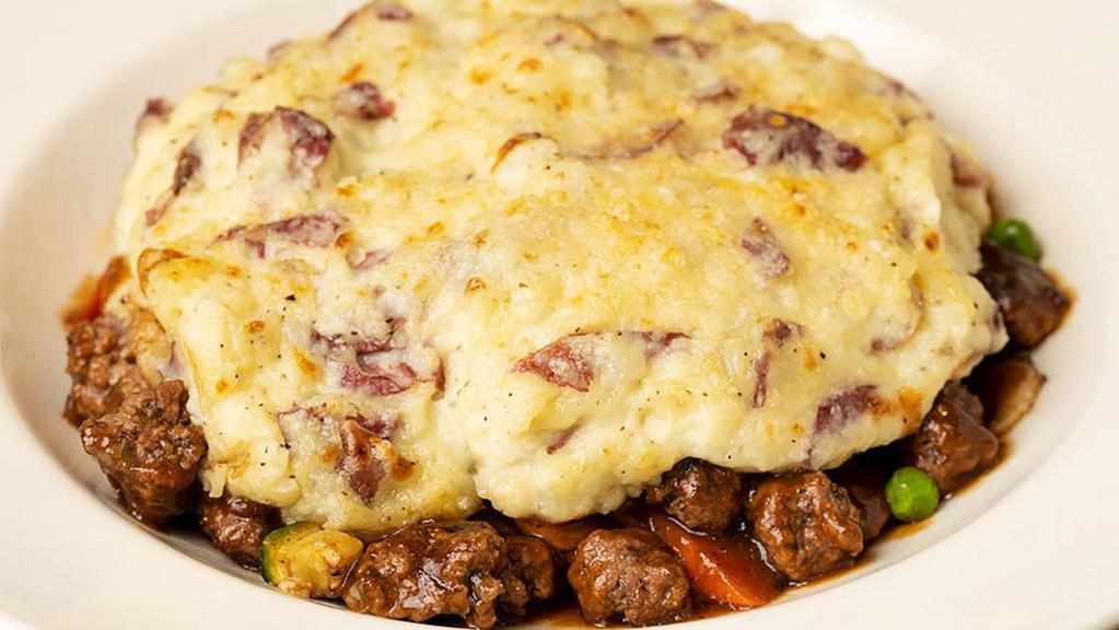 Shepherd'S Pie · Ground Beef, Carrots, Peas, Zucchini and Onions in a Delicious Mushroom Gravy Covered with a Mashed Potato-Parmesan Cheese Crust