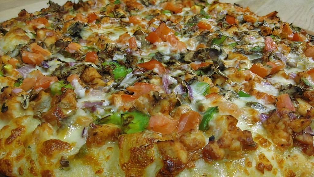 Chicken Combo · Your choice of pizza sauce or creamy garlic sauce, with mushrooms, green peppers, fresh tomatoes, onions, zesty chicken.