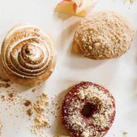 Dozen · Baker's choice of 12 gossip-worthy weekly special donuts: (2 x THE BEBOT - Ube & Leche Flan)...