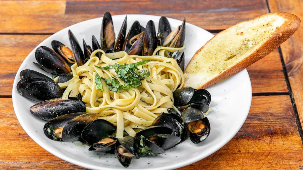 Mussels · Fettuccini pasta with mussels, pick your sauce Rosso or White wine with a touch of lemon and fresh herbs.