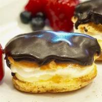 Mini Eclairs - 1 Piece · A layer of whipped cream with custard and bread covered with chocolate ganache.