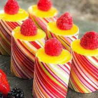 Mini Passion Fruit - 1 Piece · A combination of passion fruit mousse and raspberry mousse layered in white sponge cake.